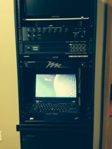 equipment rack with laptop computer for audio video installation